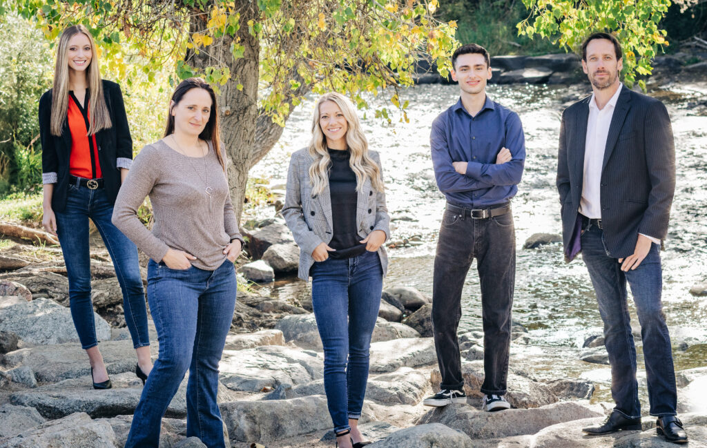 Team of Colorado Estate Matters, Ltd. attorneys standing by a river, promoting legal representation for estate planning and will contests in Lakewood, Colorado.